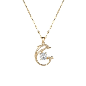 Elegant gold dolphin pendant necklace with cubic zirconia stones on thin wave chain