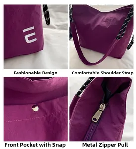 Macro detail of purple nylon tote bag featuring white embroidery and woven shoulder strap