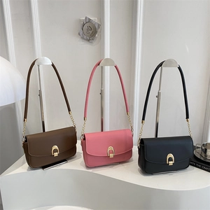 Minimalist square crossbody handbags for women in brown, pink, and black with gold hardware
