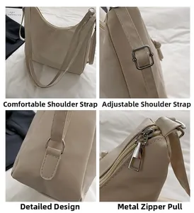 Detail view of beige nylon underarm bag showing adjustable strap and silver metal hardware