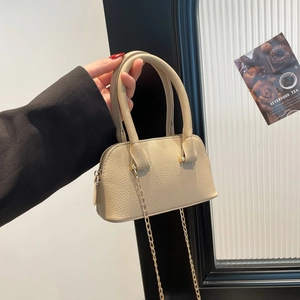 Elegant beige shell-shaped handbag with litchi texture and gold chain strap