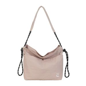 Pink nylon tote bag with black and white rope straps and IU logo in a centered studio view