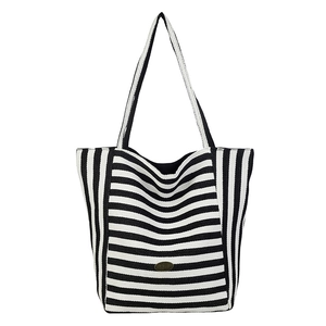 Minimalist black and white striped knit tote bag with spacious design and dual handles