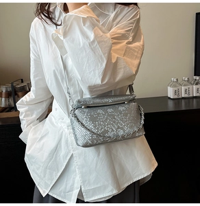 Silver snakeskin texture shoulder bag with stylish metal chain and flap closure