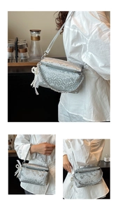 Detailed silver snake pattern box bag with metal chain and pearl bow charm accessory