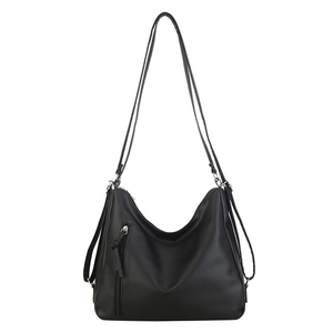 Versatile black leather hobo tote bag with multifunctional straps and tassel zippers