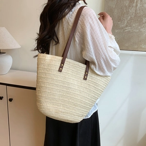 Large capacity woven straw tote bag with brown leather straps for summer beach holidays