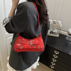 Glossy red faux leather underarm bag with silver belt buckle straps for daily commute