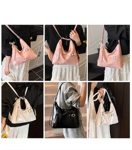 Detail of vintage glossy leather tote bag with pearl bow charm in multiple colors