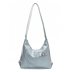 Minimalist light blue tote bag in glossy faux leather with metal buckle and shoulder strap