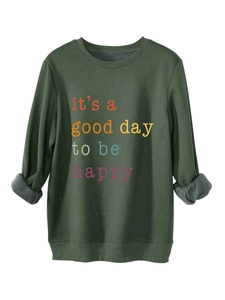 Detail of army green fleece sweatshirt featuring colorful it's a good day to be happy print
