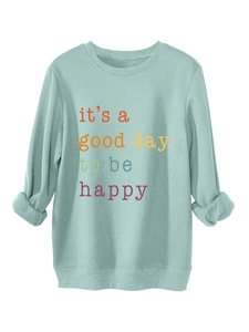 Close-up of ribbed cuffs and it's a good day to be happy print on mint green sweatshirt