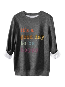 Detail of dark grey sweatshirt showing white fleece lining and colorful graphic print