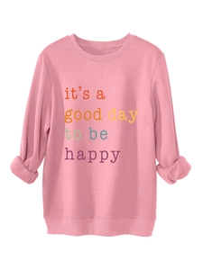 Close-up of pink casual thick fleece sweatshirt with colorful 'it's a good day' slogan