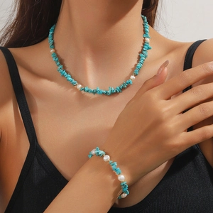 Bohemian turquoise and pearl necklace set shown on model with gold bead accents