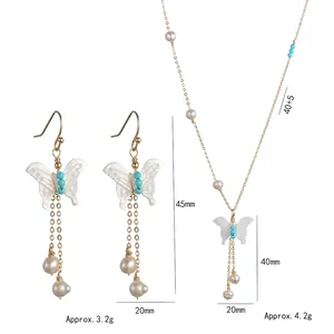 Set collana a farfalla vintage e orecchini con perle e nappe per donne eleganti