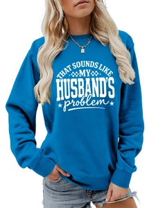 Detailed view of blue crewneck sweatshirt featuring white husband quote print and ribbed cuffs