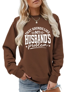 Detail of a brown long sleeve sweatshirt with white slogan and ribbed collar texture