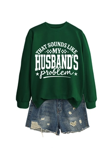 Deep green crewneck sweatshirt with slogan print and distressed denim shorts