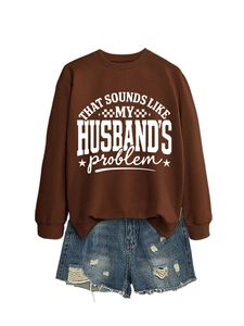 Detail of coffee brown crewneck sweatshirt with 'That sounds like my husband's problem' text