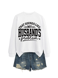 Detail of white crewneck sweatshirt with black 'That sounds like my husband's problem' print