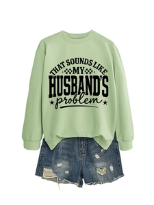 Detail of light green sweatshirt with ribbed crew neck and black husband's problem print