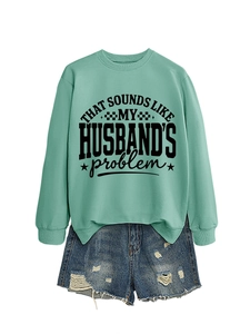 Detail of mint green sweatshirt with husband slogan and distressed denim shorts set
