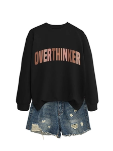 Detailed flat lay of a black crewneck sweatshirt with OVERTHINKER arch letter print