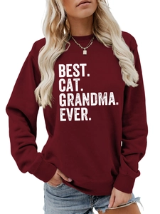 Detail view of burgundy sweatshirt featuring white Best Cat Grandma Ever printed text