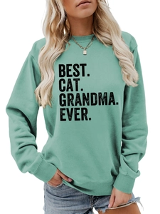 Detail of mint green sweatshirt with bold Best Cat Grandma Ever lettering and ribbed cuffs