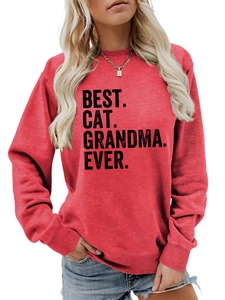 Close-up of Best Cat Grandma Ever print on a red long sleeve crewneck sweatshirt