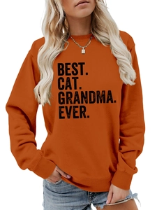 Close-up of Best Cat Grandma Ever print on orange crewneck sweatshirt for women
