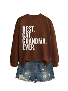 Detail of Best Cat Grandma Ever print on brown sweatshirt paired with denim shorts