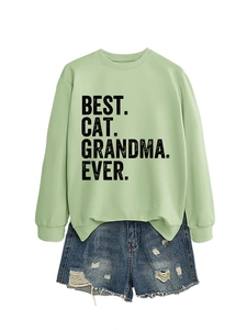 Detail of Best Cat Grandma Ever print on light green sweatshirt with denim shorts
