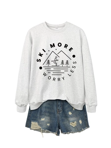 Detail of light grey crewneck sweatshirt with Ski More Worry Less print and ripped denim shorts