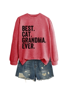 Detail of Best Cat Grandma Ever print on dark red sweatshirt paired with denim shorts