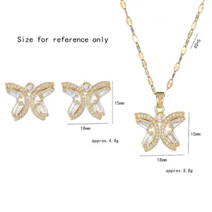 Golden butterfly jewelry set with zircon necklace and earrings on white background