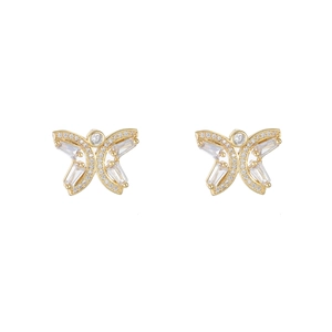 Close-up of golden butterfly earrings featuring baguette and round zircon inlay details
