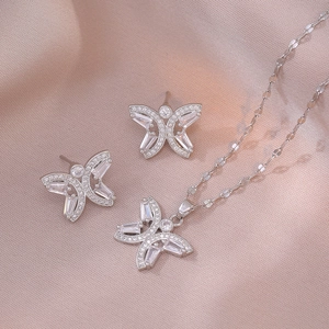 Elegant butterfly jewelry set with zircon crystals and polished silver chain