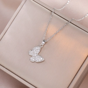 Elegant silver butterfly pendant necklace with sparkling cubic zirconia on satin jewelry box