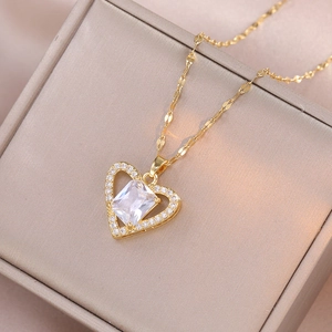 Golden heart necklace with rectangular crystal and micro-pave diamonds on jewelry box