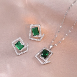 Elegant silver jewelry set with emerald cut green zircon necklace and matching stud earrings