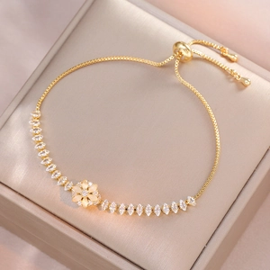 Elegante bracciale floreale dorato con pietre occhio di gatto gialle e catena regolabile