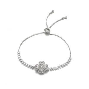 Macro detail of silver clover bracelet with zircon stones and adjustable bolo clasp