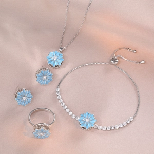 Daisy jewelry set with blue enamel flower necklace, earrings, ring and bracelet