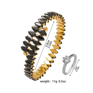 Detailed size view of a gold marquise-cut stone bangle and a silver diamond ring set