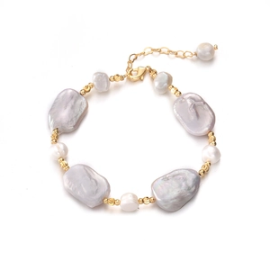 Detail of baroque freshwater pearl bracelet with embossed gold beads and lobster clasp