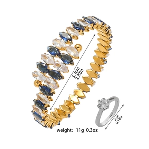 Detailed size view of gold open bangle with colorful marquise zircons and silver ring