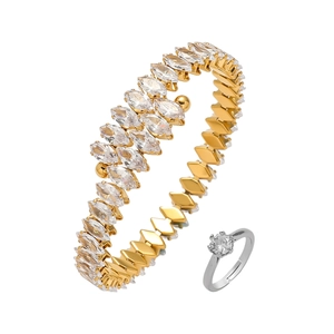 Detail of gold layered marquise zircon bangle and silver six-claw diamond ring set