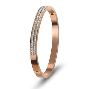 Close-up of rose gold bangle with double rows of square cubic zirconia stones